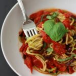 Picture of zucchini noodles dish with tomato and basil